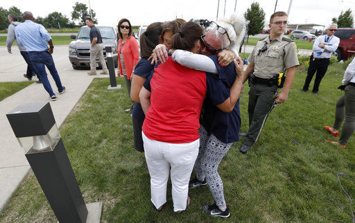The Latest: Suspect worked at farm tied to Republican farmer